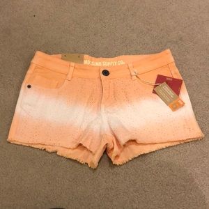 Ombré orange > white > orange cutoff jean shorts